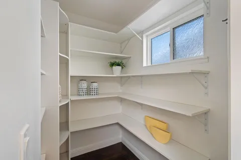 a view of an empty walk in closet