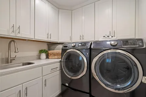 a spacious bedroom with a large bed and a couch