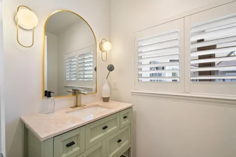 a bed room with a bed and a large window