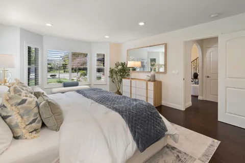 a spacious bathroom with a shower sink mirror and a shower