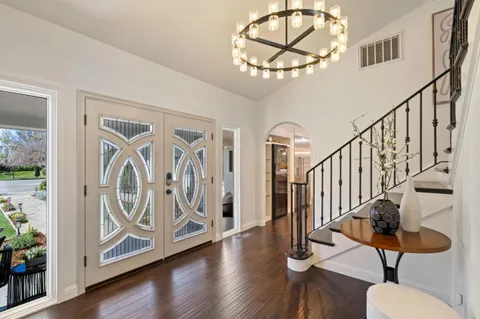 a view of an entryway with wooden floor
