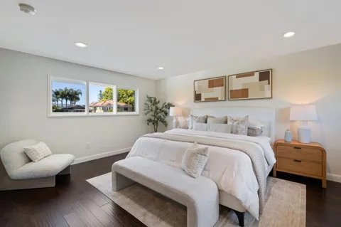 a spacious bathroom with a double vanity sink and a large mirror