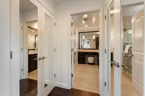 a bedroom with a bed and a painting