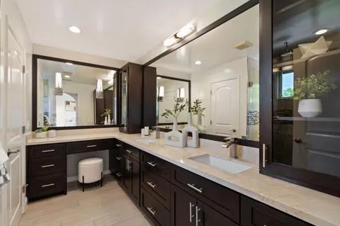 a bedroom with a bed and a view of kitchen