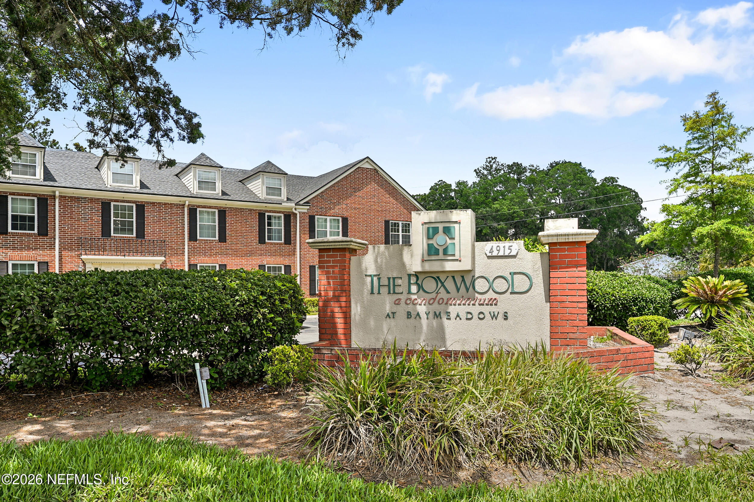 4915 Baymeadows Road, Unit 6G Jacksonville, FL 32217 - Photo 43 of 44 a sign board with a house in the background