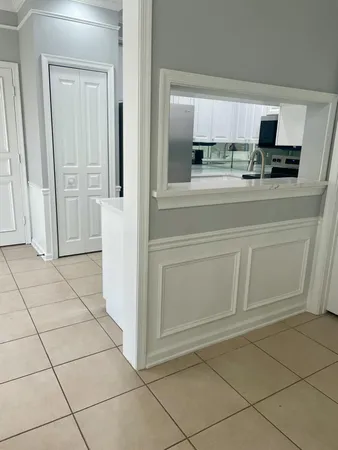 a kitchen with a stove and a refrigerator