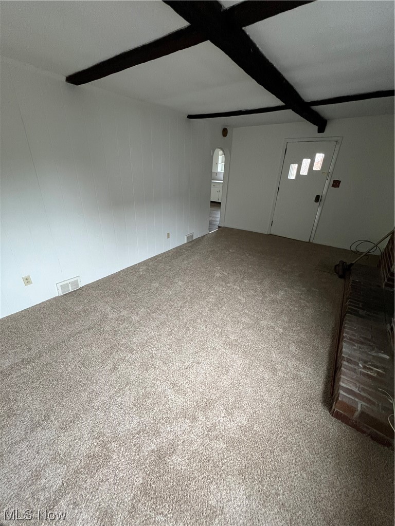 545 7th Street Struthers, OH 44471 - Photo 5 of 17 Unfurnished room featuring beamed ceiling and carpet