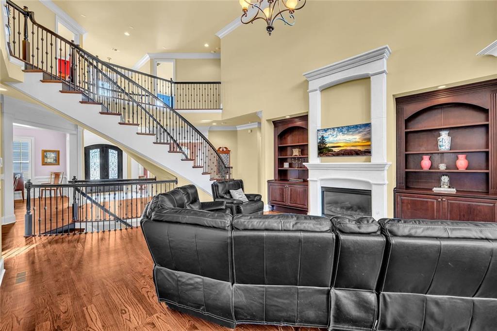 245 Arledge Lane Southwest Atlanta, GA 30331 - Photo 11 of 47 a living room with fireplace furniture and a wooden floor