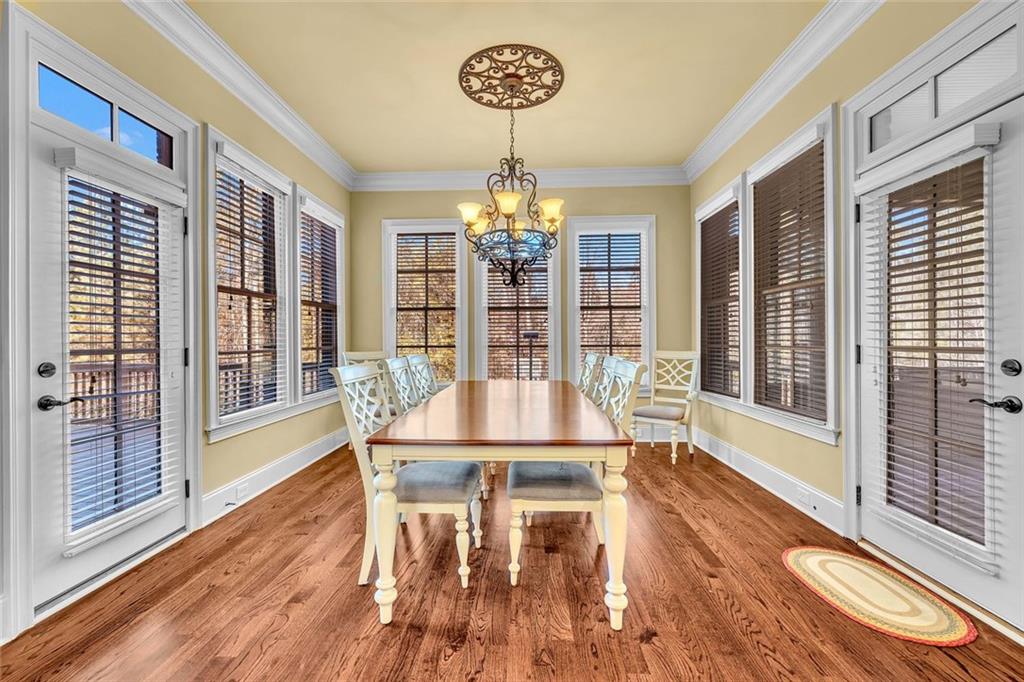 245 Arledge Lane Southwest Atlanta, GA 30331 - Photo 16 of 47 a view of a dining room with furniture wooden floor and chandelier