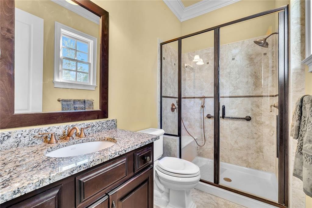 245 Arledge Lane Southwest Atlanta, GA 30331 - Photo 18 of 47 a bathroom with a granite countertop sink toilet and shower