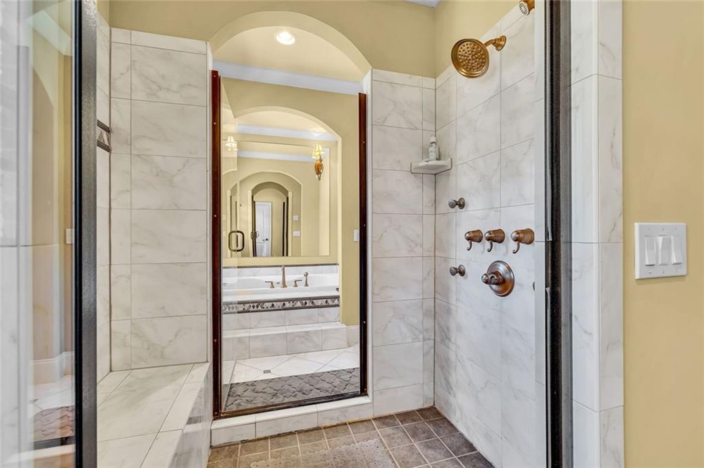 245 Arledge Lane Southwest Atlanta, GA 30331 - Photo 25 of 47 a bathroom with a bathtub and a shower