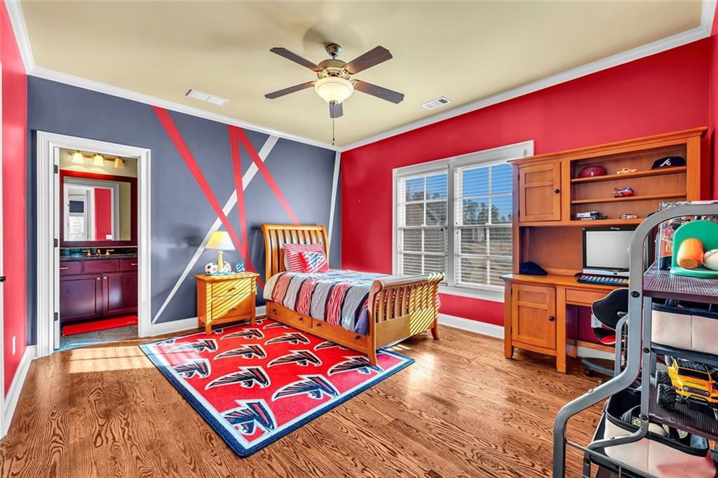 245 Arledge Lane Southwest Atlanta, GA 30331 - Photo 29 of 47 a bedroom with furniture and a flat screen tv