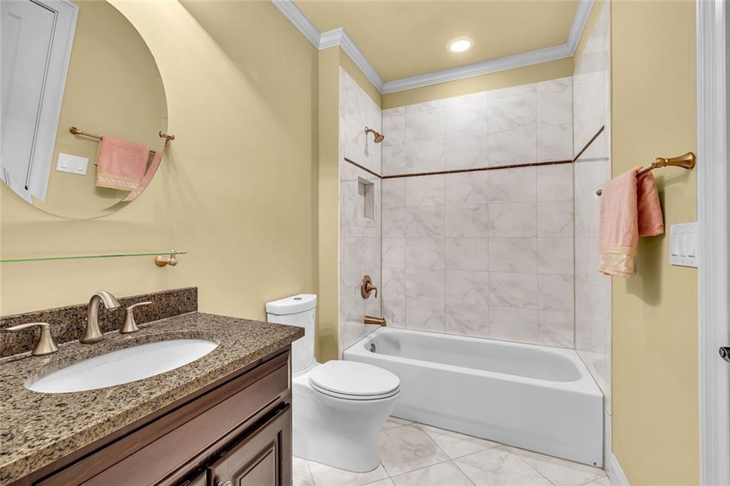 245 Arledge Lane Southwest Atlanta, GA 30331 - Photo 36 of 47 a bathroom with a granite countertop sink toilet and shower