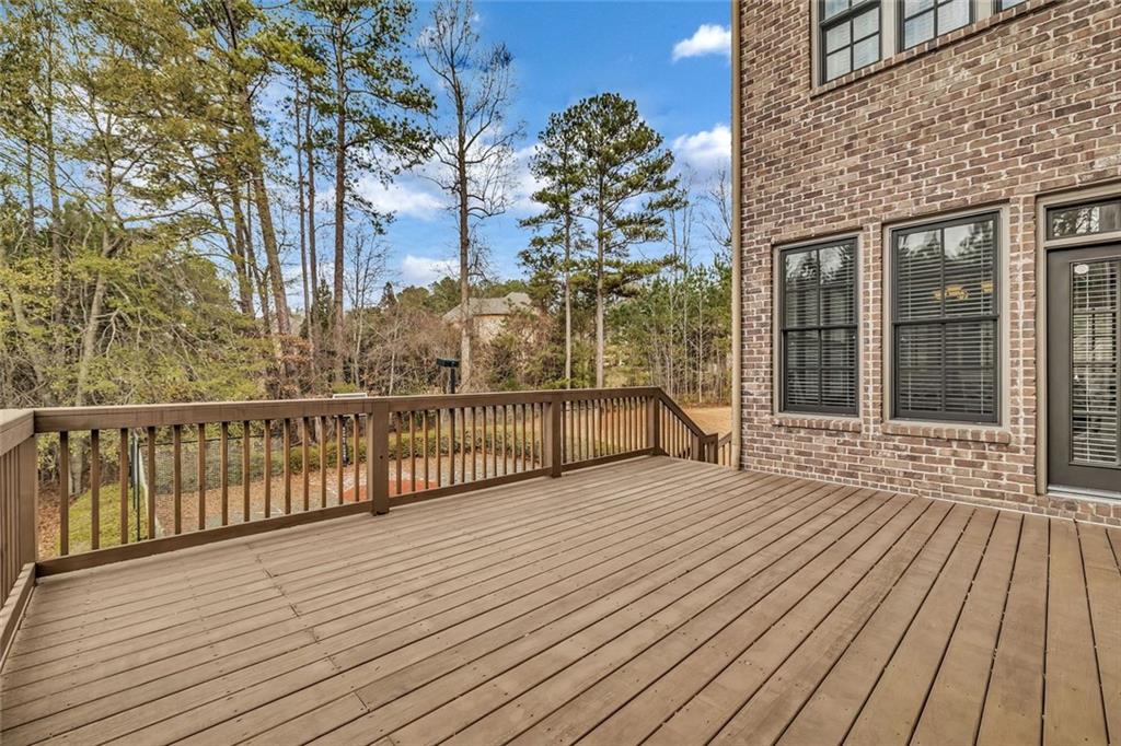 245 Arledge Lane Southwest Atlanta, GA 30331 - Photo 45 of 47 a view of a balcony with wooden floor and fence