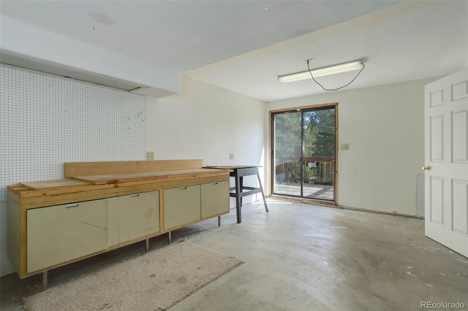 9209 Fallen Rock Road Conifer, CO 80433 - Photo 29 of 33 a room with storage and utility