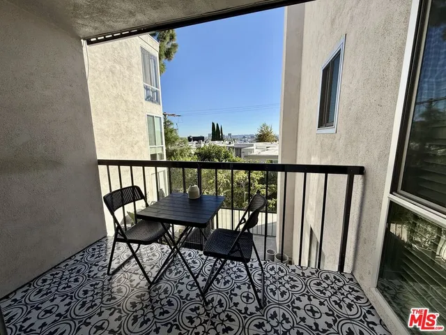 a balcony with wooden floor