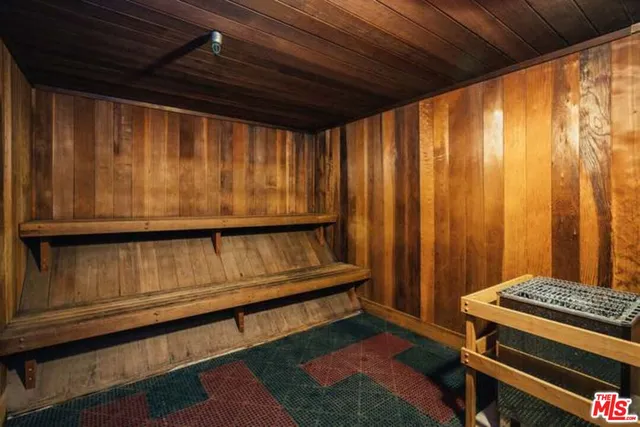 an outdoor space with swimming pool and furniture