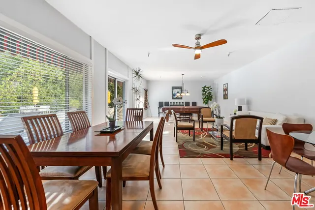 a front view of a building with a garden