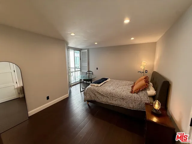 a bedroom with bed and window