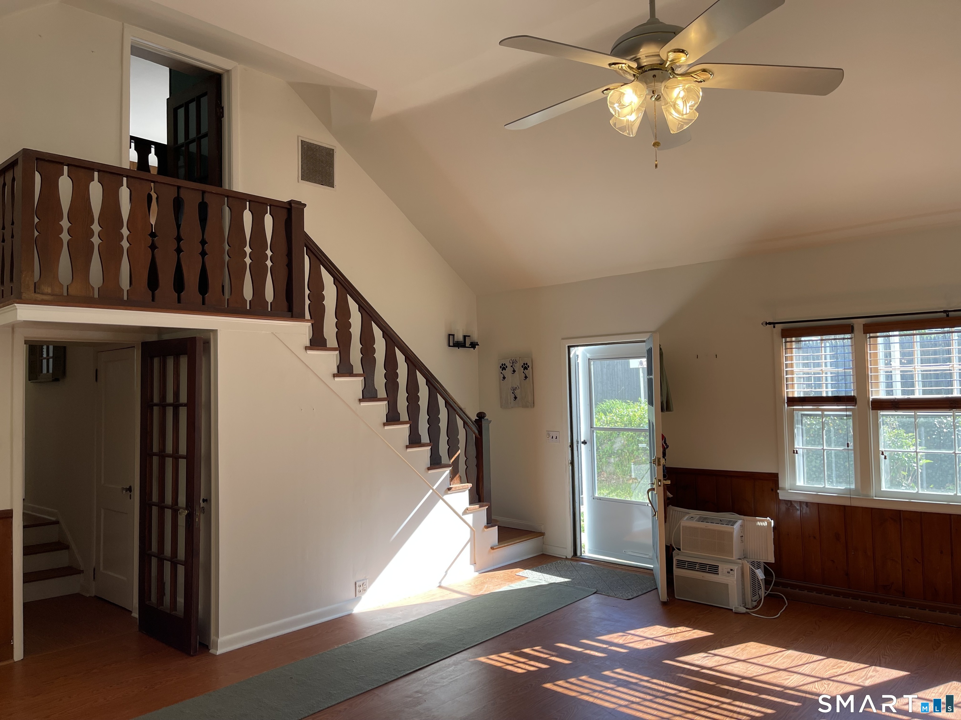 89 Alpine Drive Newtown, CT 06482 - Photo 11 of 32 a view of a livingroom with furniture window wooden floor and staircase