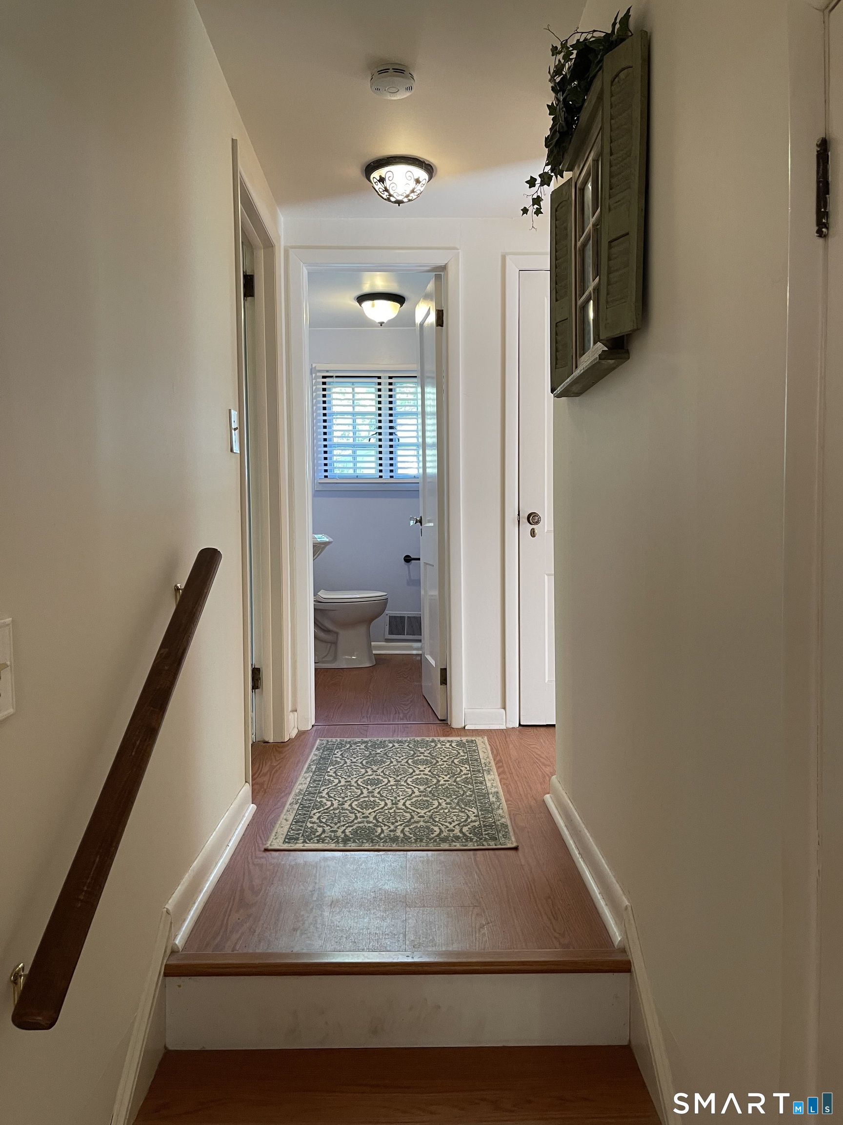 89 Alpine Drive Newtown, CT 06482 - Photo 17 of 32 a view of a hallway to a livingroom and a couch