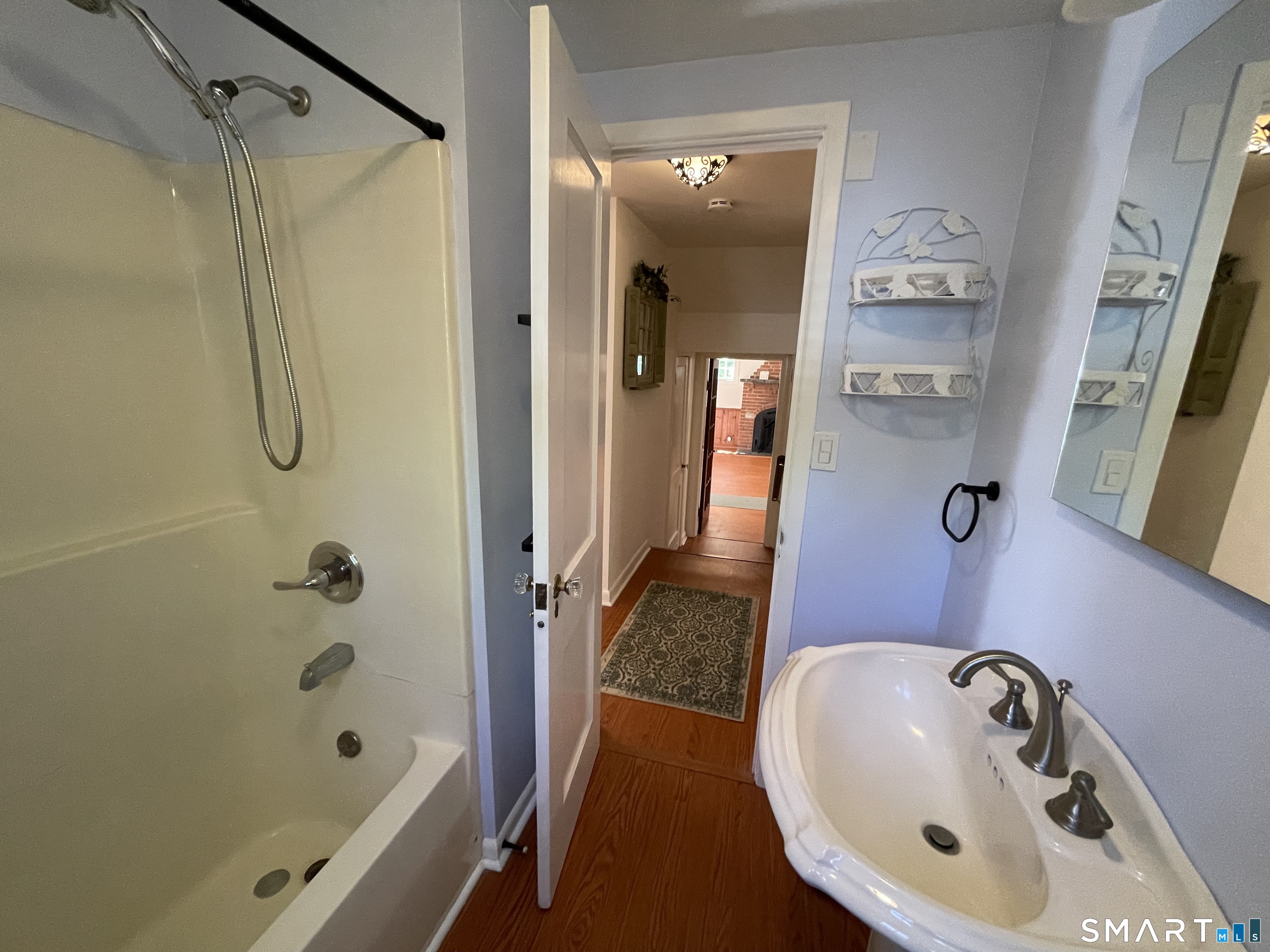 89 Alpine Drive Newtown, CT 06482 - Photo 18 of 32 a bathroom with a tub sink and mirror