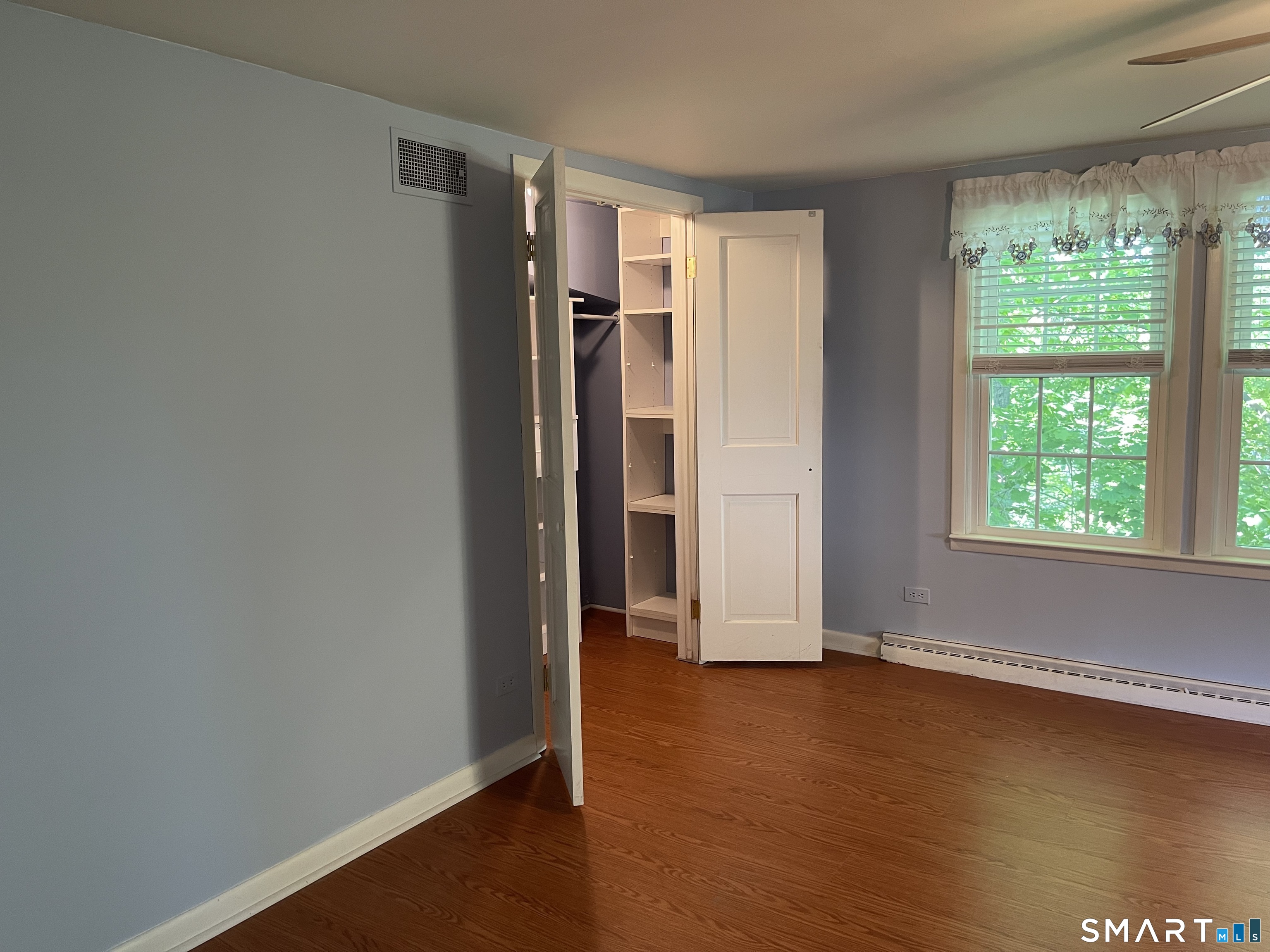89 Alpine Drive Newtown, CT 06482 - Photo 20 of 32 an empty room with wooden floor and a window