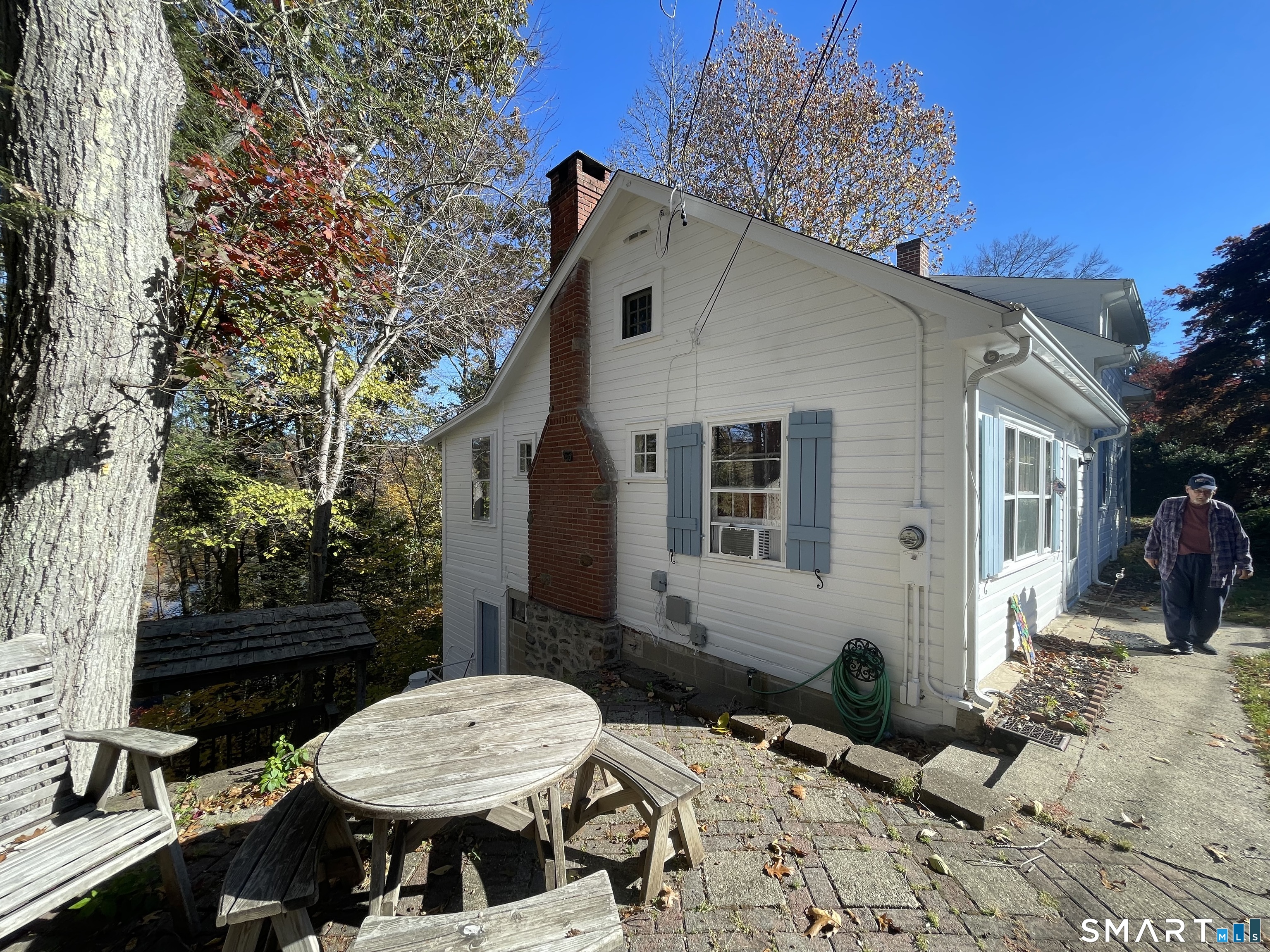 89 Alpine Drive Newtown, CT 06482 - Photo 2 of 32 a view of a patio with table and chairs near a barbeque