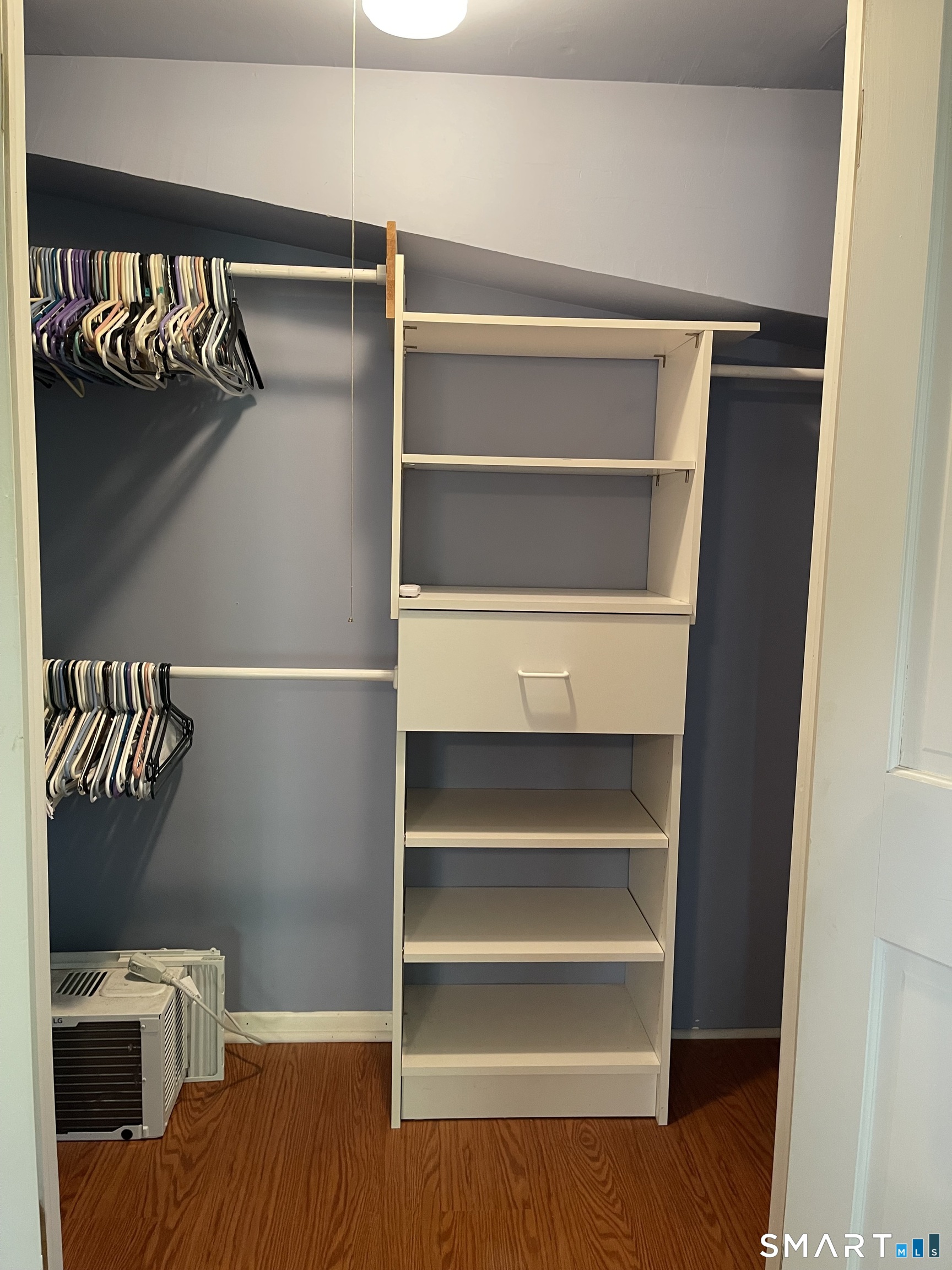 89 Alpine Drive Newtown, CT 06482 - Photo 22 of 32 a view of walk in closet with empty racks