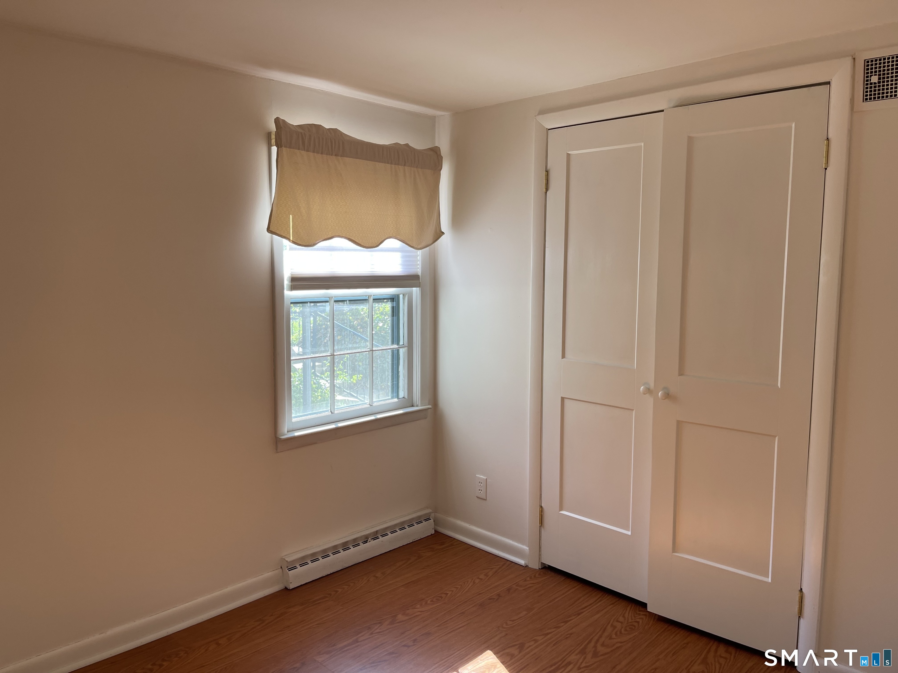 89 Alpine Drive Newtown, CT 06482 - Photo 23 of 32 an empty room with windows and closet