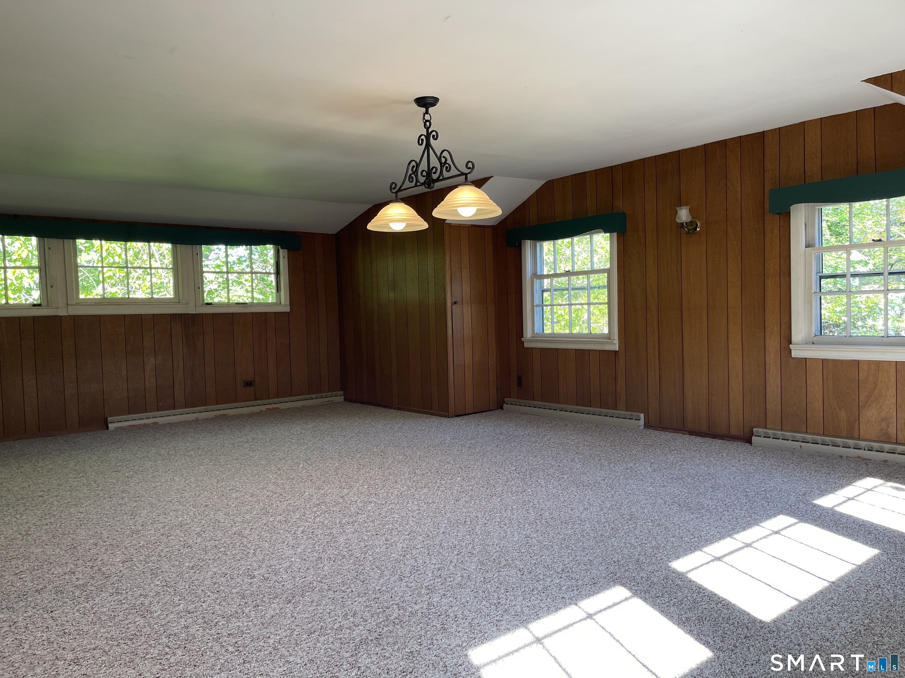 89 Alpine Drive Newtown, CT 06482 - Photo 27 of 32 an empty room with windows cabinet and mountain view