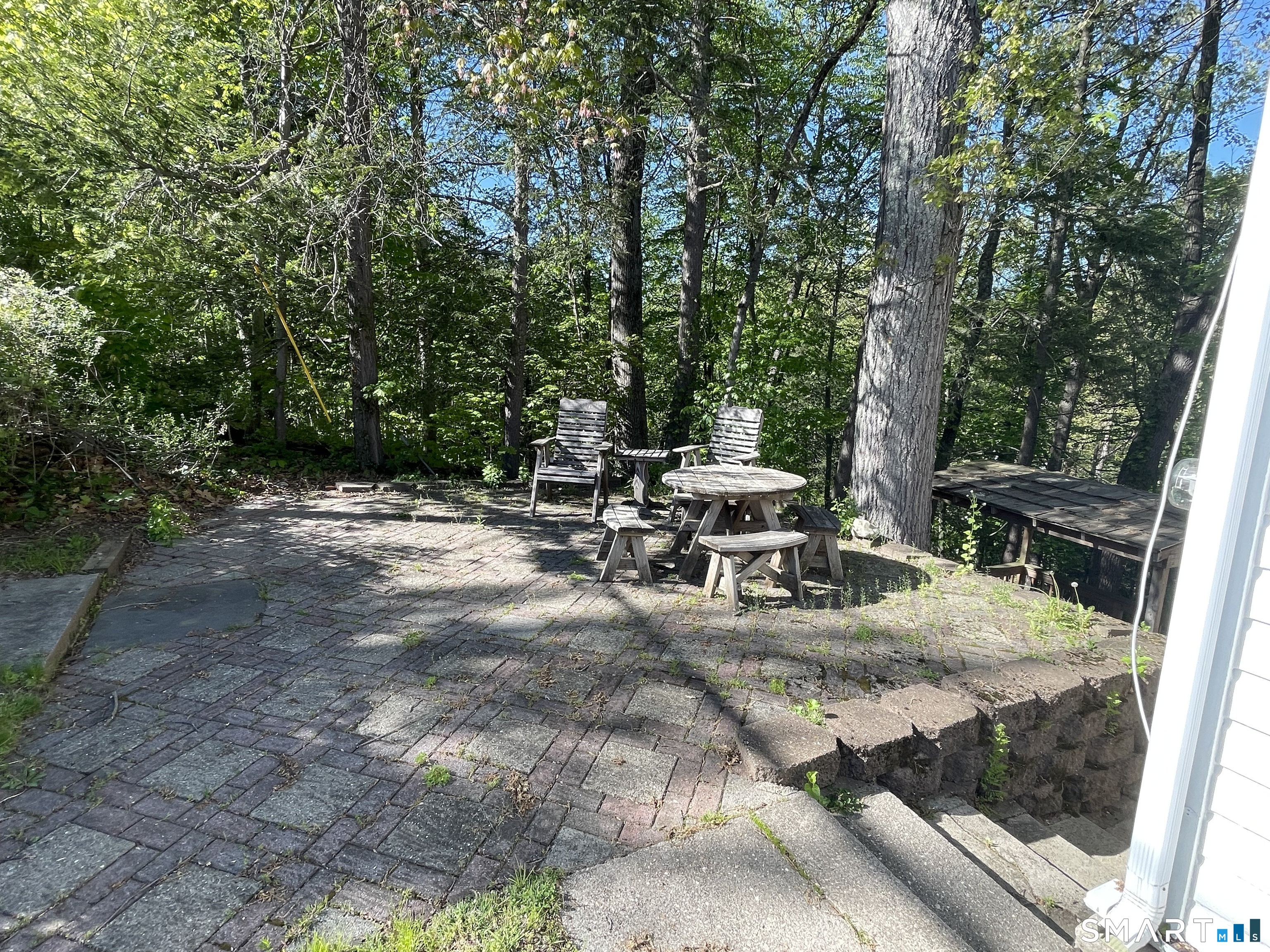 89 Alpine Drive Newtown, CT 06482 - Photo 3 of 32 a view of backyard with a table and chairs with wooden fence and large trees