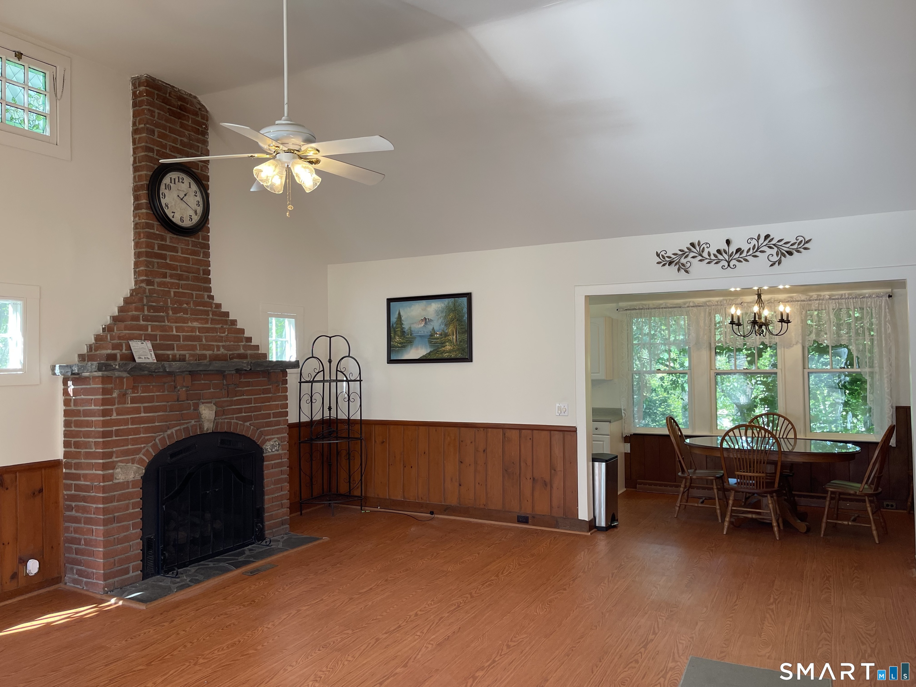 89 Alpine Drive Newtown, CT 06482 - Photo 9 of 32 a living room with furniture a fireplace and a large window