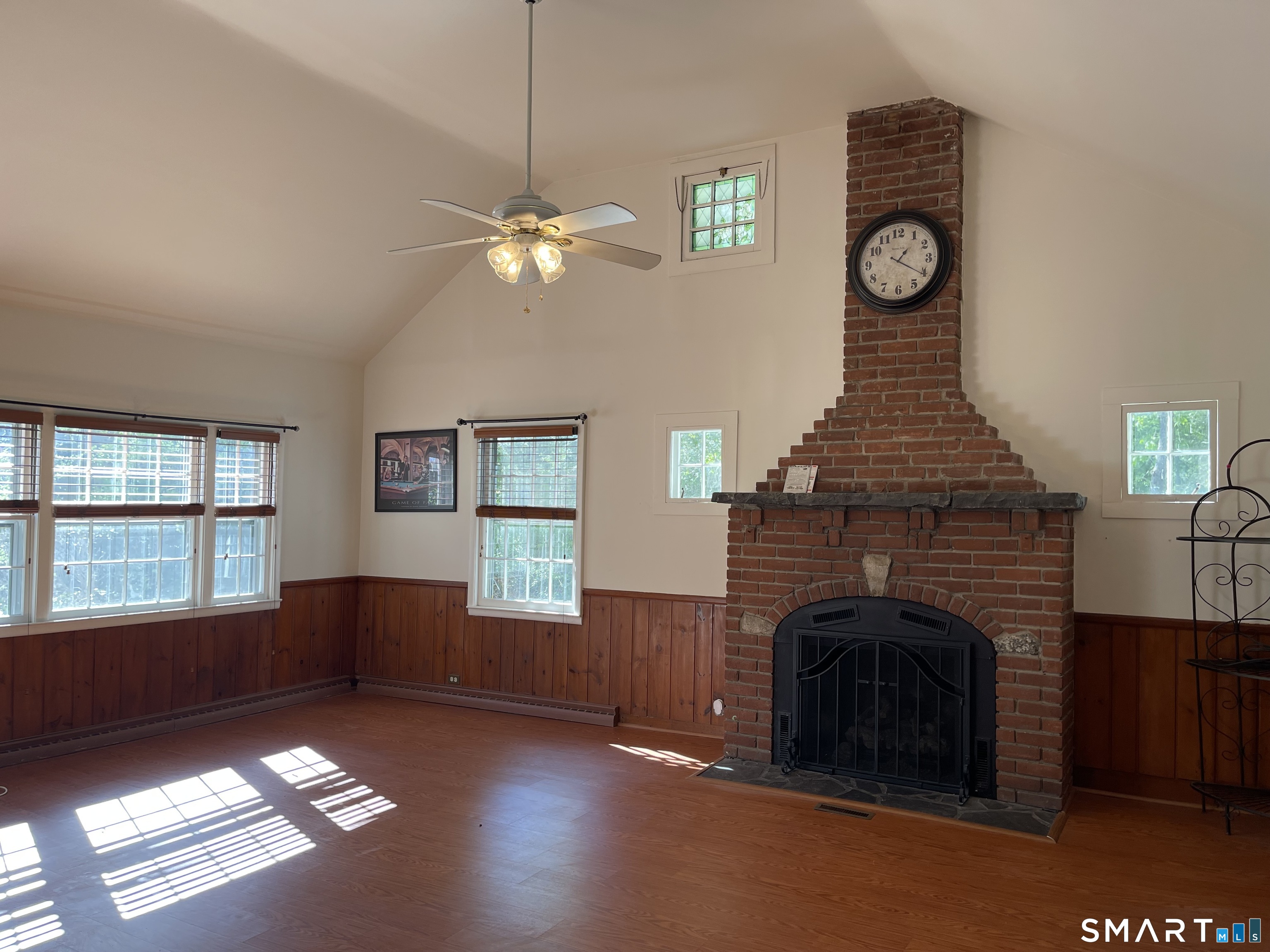 89 Alpine Drive Newtown, CT 06482 - Photo 10 of 32 a view of livingroom with window fireplace and fan