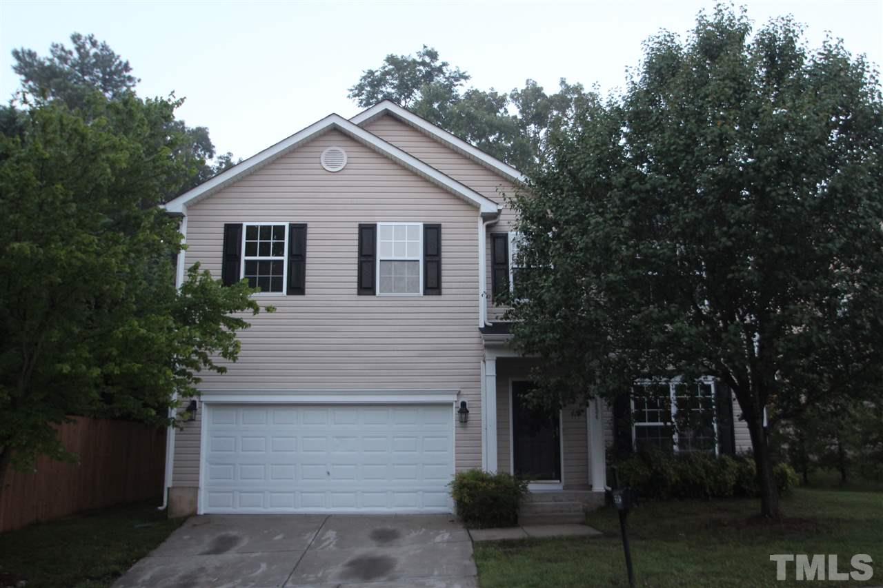 5334 Stowecroft Lane Raleigh, NC 27616 - Photo 1 of 15 a front view of a house with a yard and garage