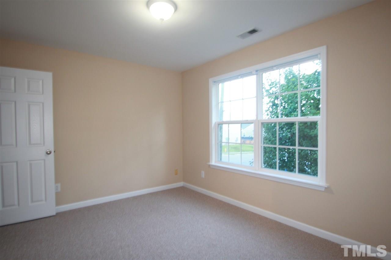 5334 Stowecroft Lane Raleigh, NC 27616 - Photo 12 of 15 an empty room with a window