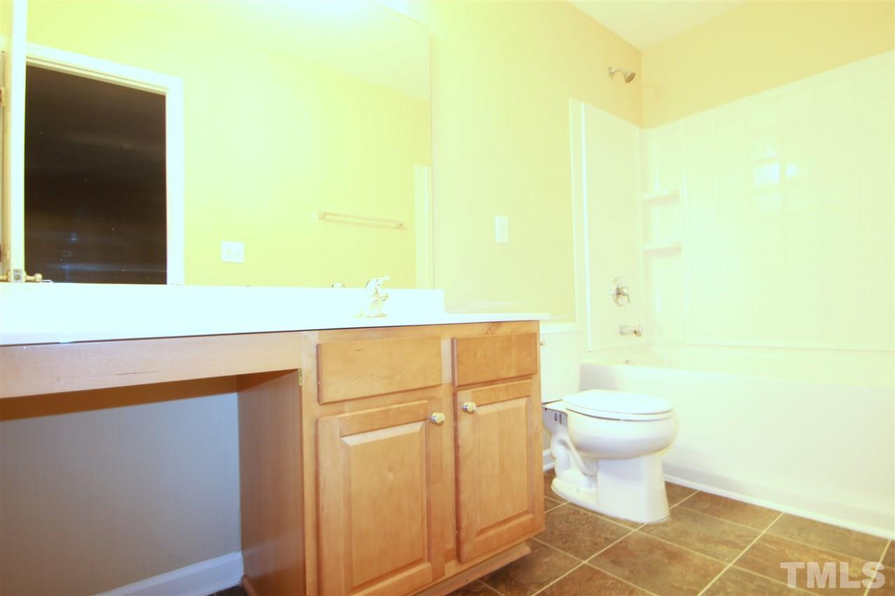 5334 Stowecroft Lane Raleigh, NC 27616 - Photo 13 of 15 a bathroom with a toilet and a shower