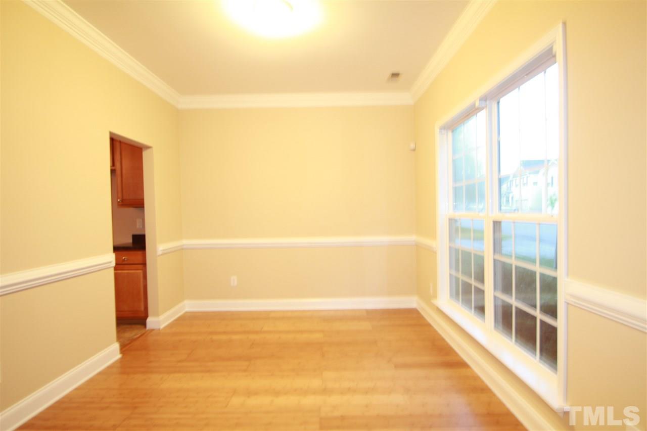 5334 Stowecroft Lane Raleigh, NC 27616 - Photo 3 of 15 a view of empty room with wooden floor and windows