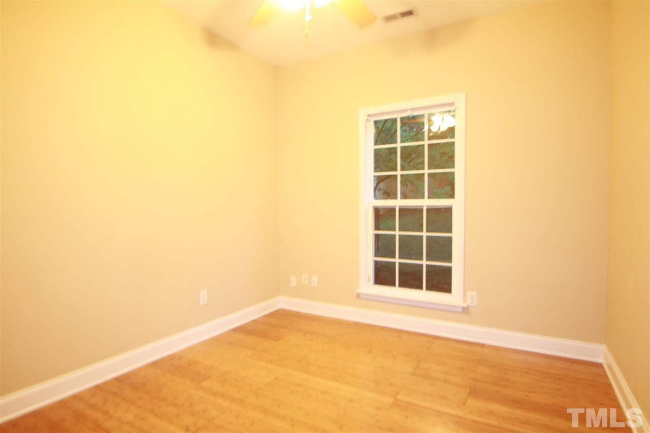 5334 Stowecroft Lane Raleigh, NC 27616 - Photo 6 of 15 a view of an empty room with a window