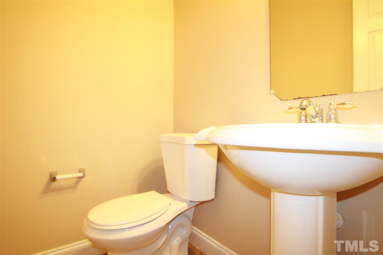 5334 Stowecroft Lane Raleigh, NC 27616 - Photo 7 of 15 a bathroom with a toilet and a sink