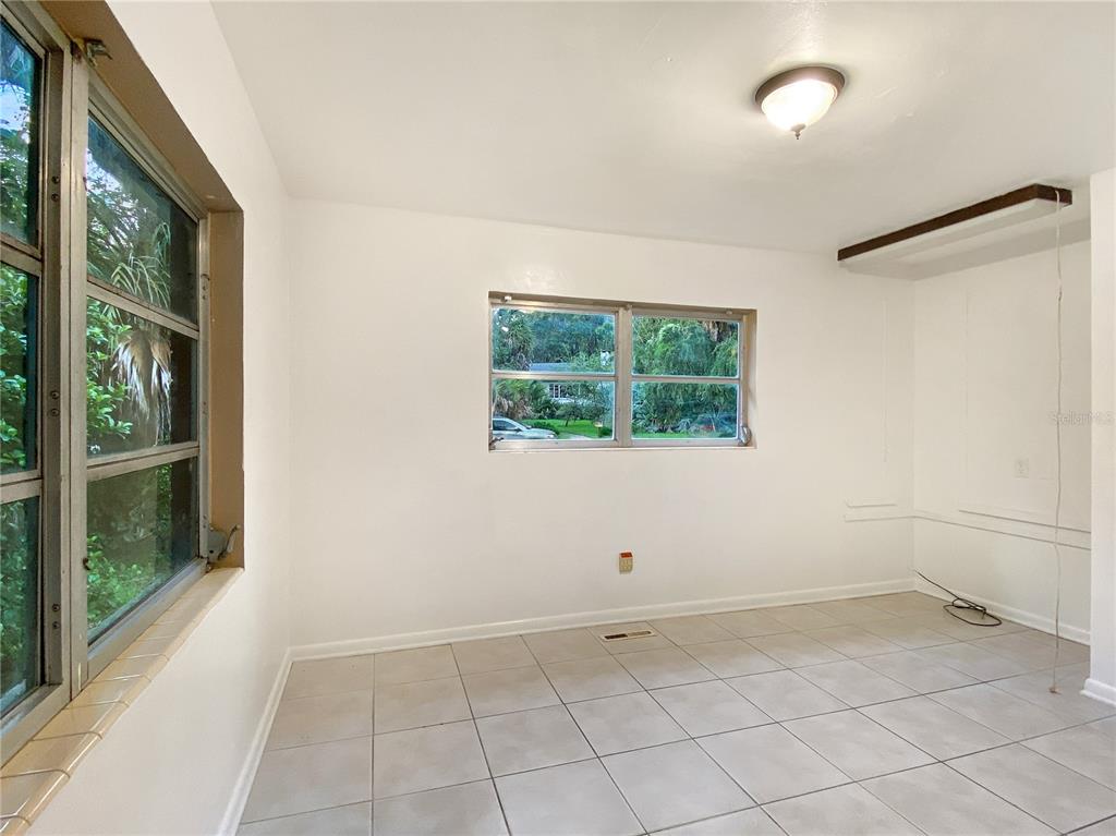 1119 Southwest 11th Avenue Gainesville, FL 32601 - Photo 19 of 30 an empty room with a window