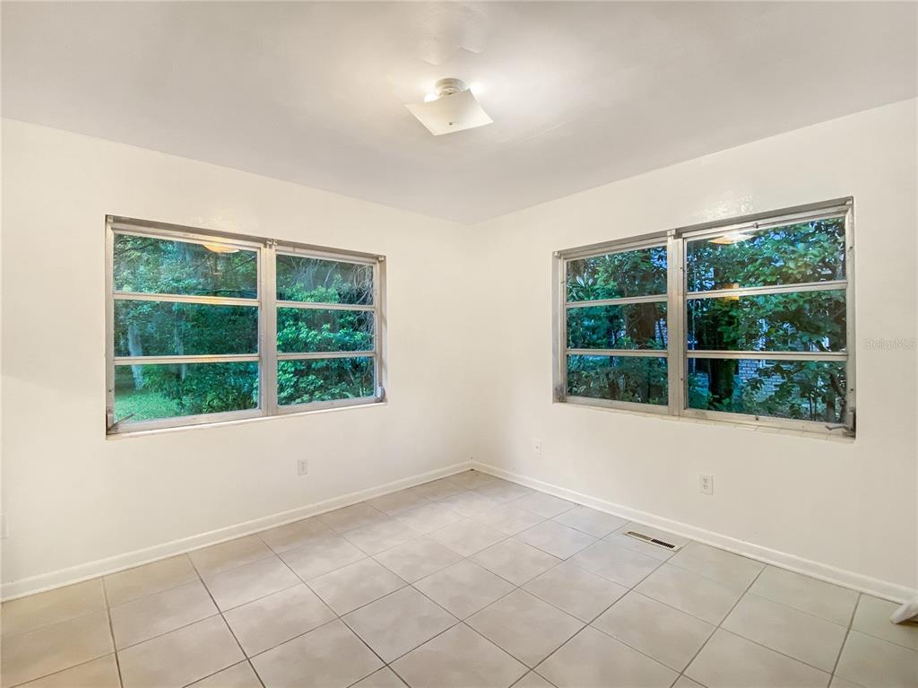 1119 Southwest 11th Avenue Gainesville, FL 32601 - Photo 20 of 30 an empty room with a window