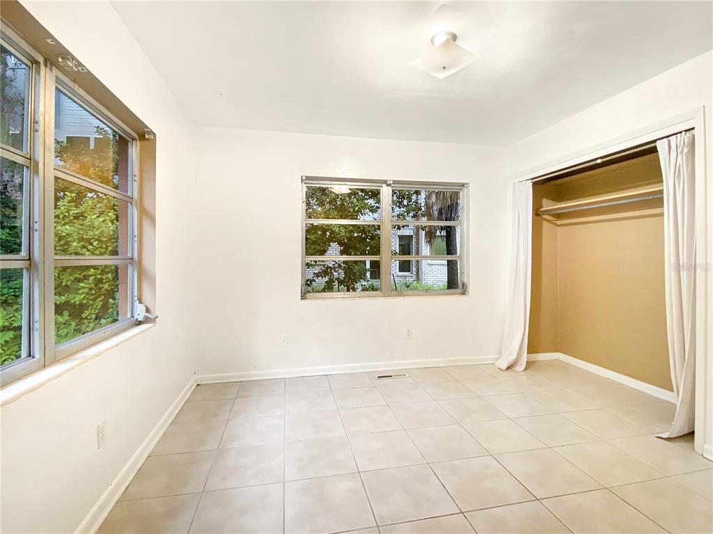 1119 Southwest 11th Avenue Gainesville, FL 32601 - Photo 24 of 30 an empty room with windows