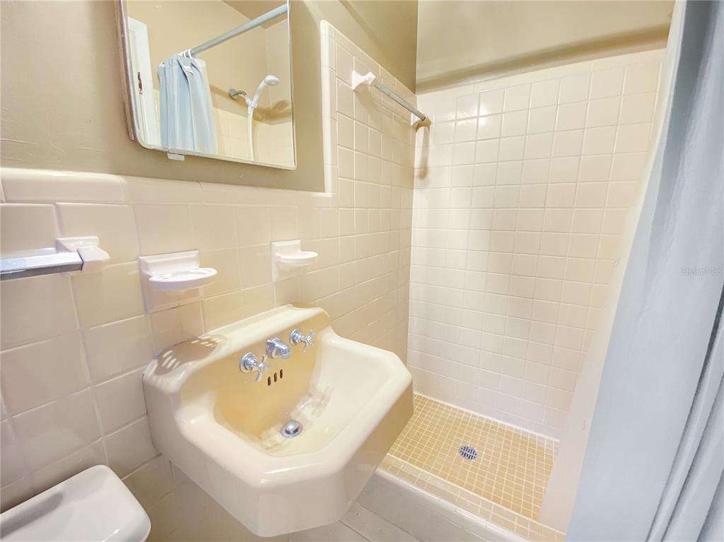 1119 Southwest 11th Avenue Gainesville, FL 32601 - Photo 26 of 30 a bathroom with a bathtub and a sink