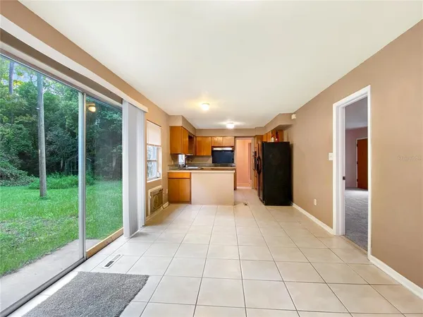 a kitchen with stainless steel appliances granite countertop a sink and a microwave