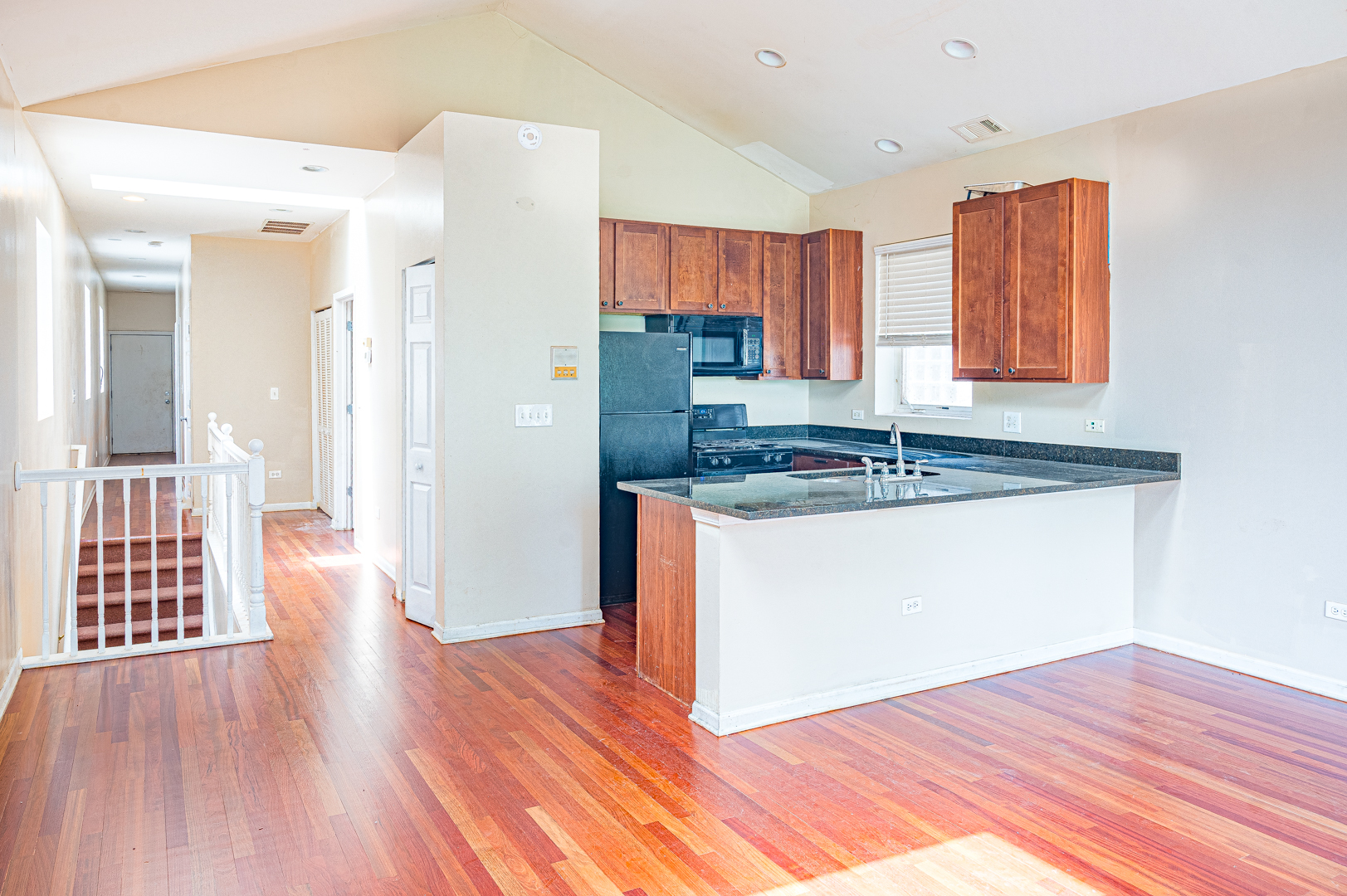 7652 South Colfax Avenue Chicago, IL 60649 - Photo 4 of 11 a view of kitchen and wooden floor