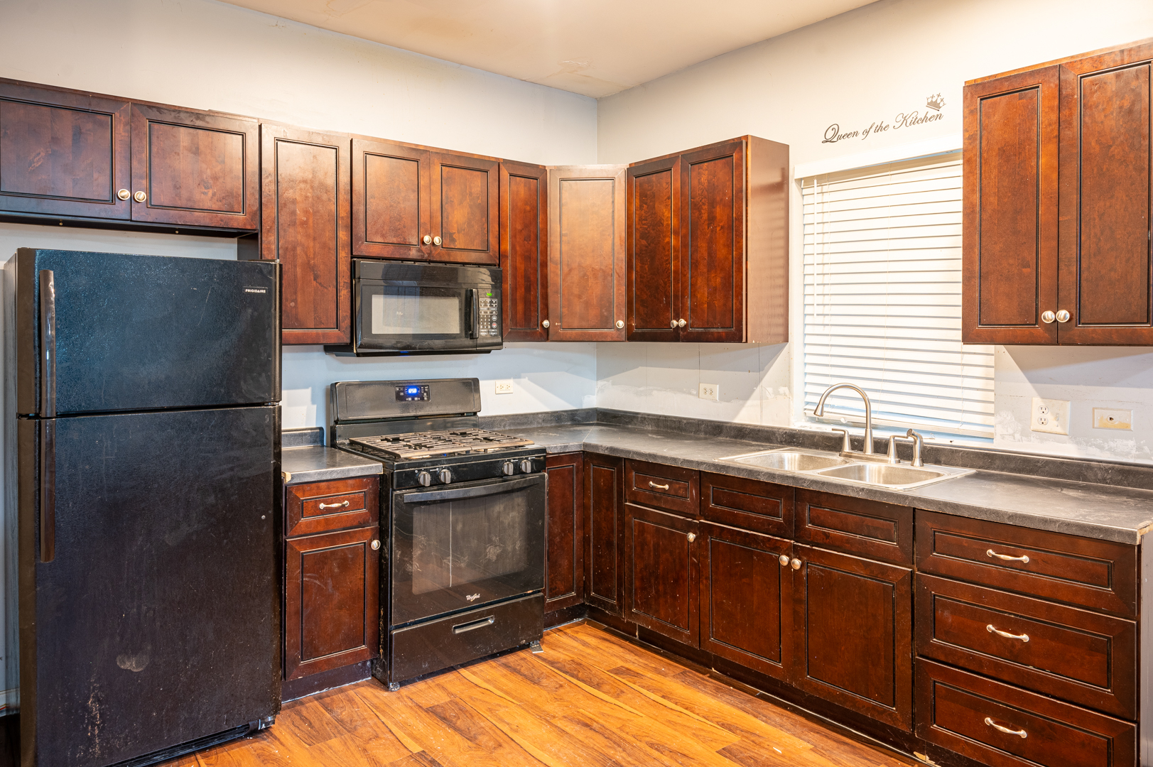 7652 South Colfax Avenue Chicago, IL 60649 - Photo 7 of 11 a kitchen with stainless steel appliances granite countertop a refrigerator a stove a sink and a microwave