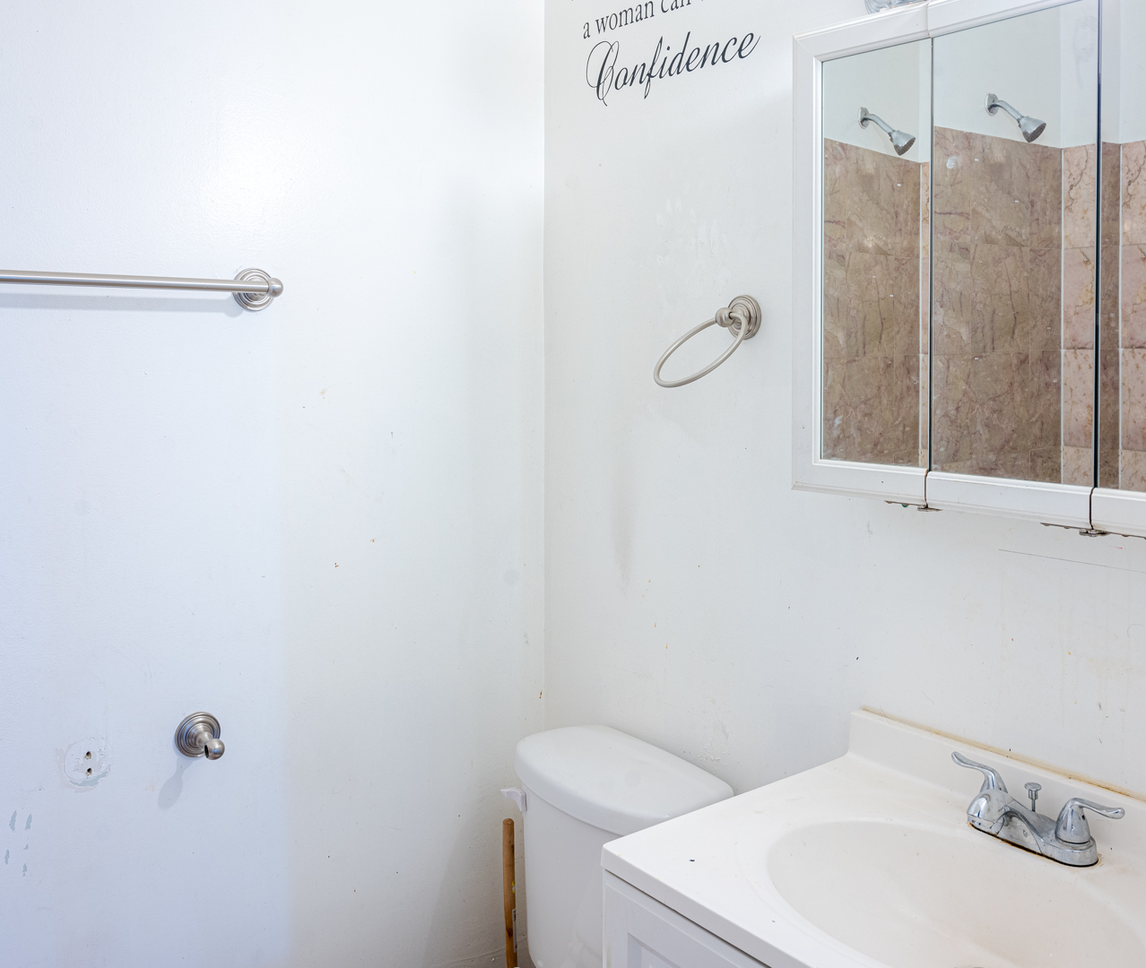 7652 South Colfax Avenue Chicago, IL 60649 - Photo 10 of 11 a bathroom with a sink and shower