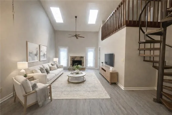 a living room with furniture and a fireplace