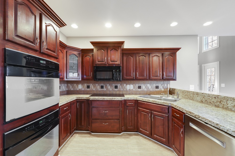 813 Speck Road Lebanon, TN 37087 - Photo 22 of 48 a kitchen with a sink stove top oven and cabinets